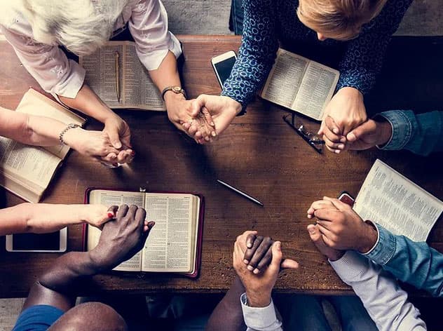 Church members gathered for a prayer meeting